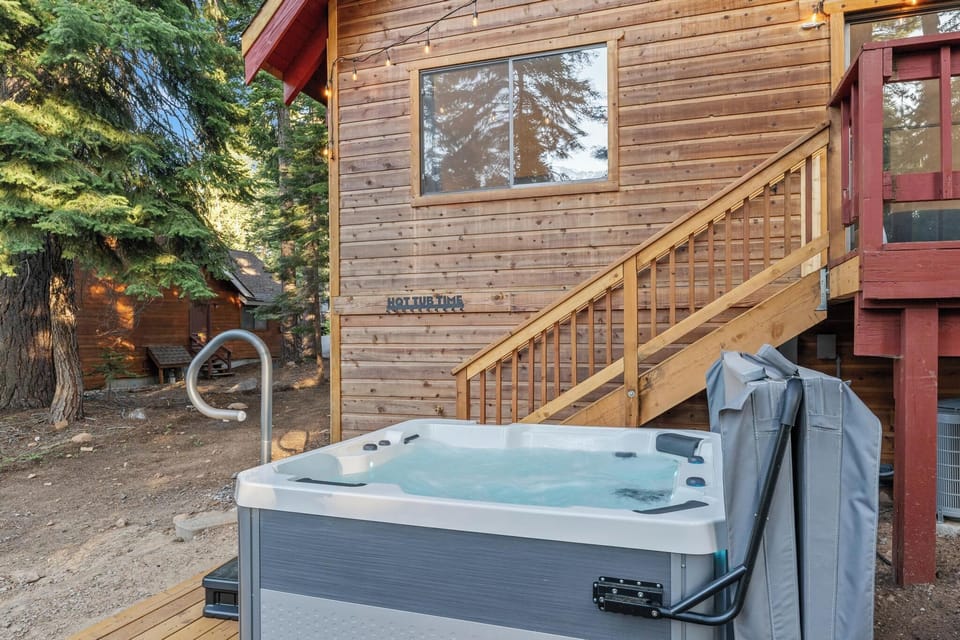 6 person hot tub back deck access with stairs leading to hot tub pad
