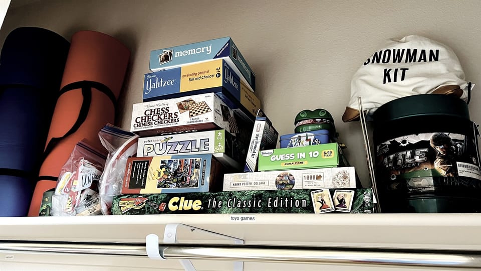 Games and yoga mats in main bedroom closet