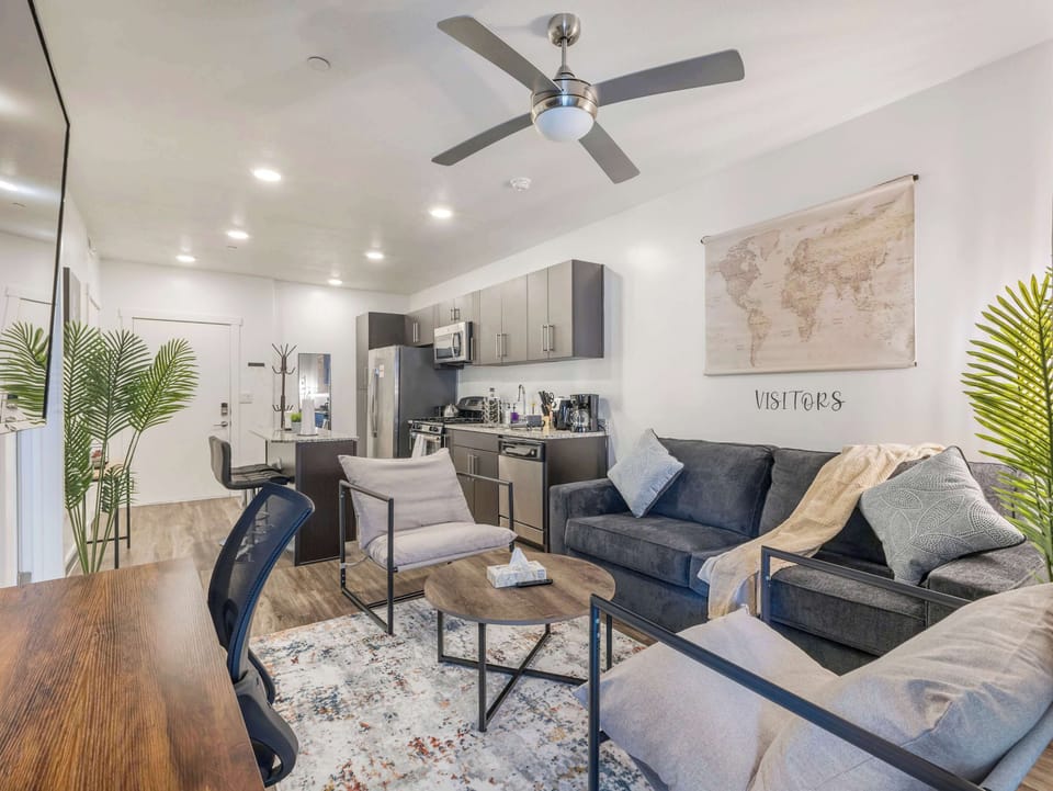 Open concept living & dining area w/ comfy seating & modern finishes throughout