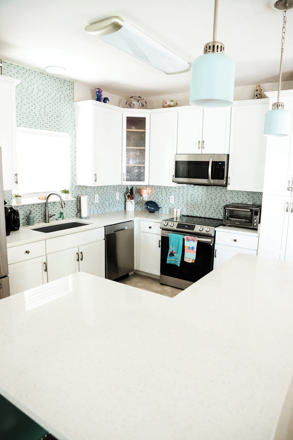 Fully stocked kitchen with stainless steel appliances