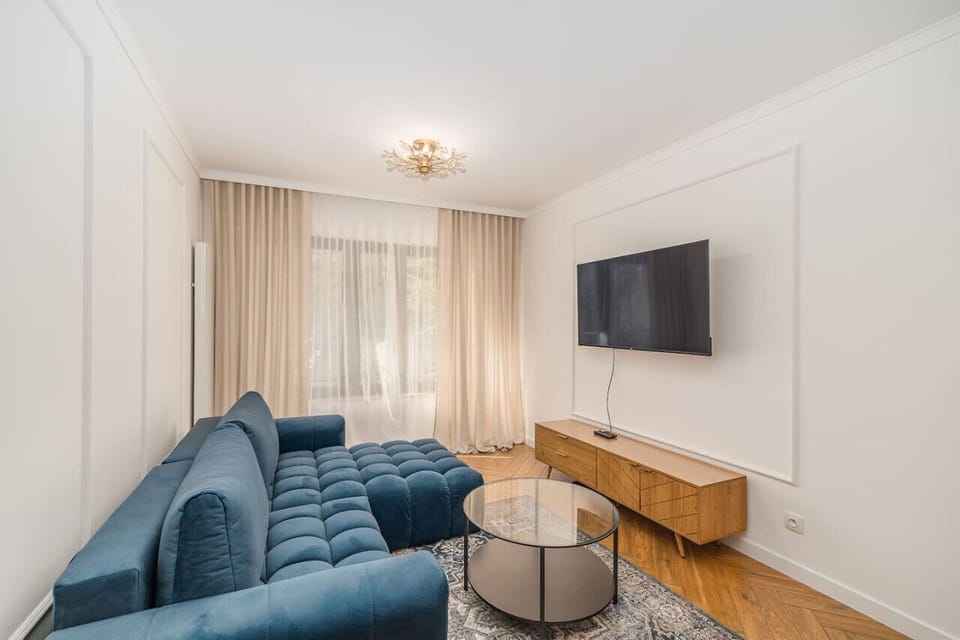 Comfortable Living Room with Sofa Bed and Smart TV | Book Now with RENTUJEMY