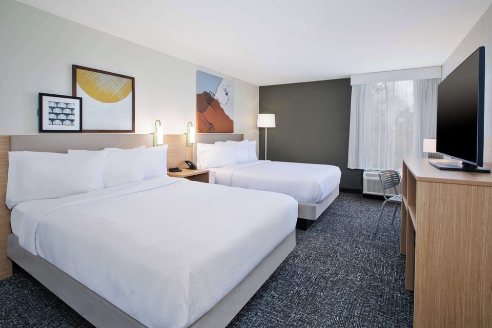 Room, 2 Queen Beds | In-room safe, iron/ironing board, free WiFi, bed sheets