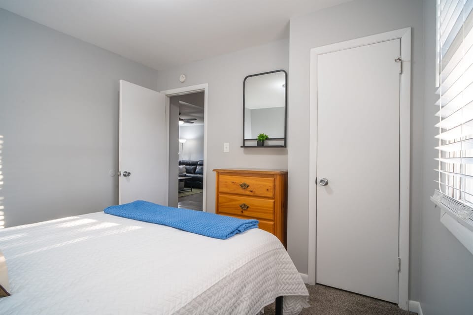 3rd bedroom with dresser and closet for all your clothing storage.