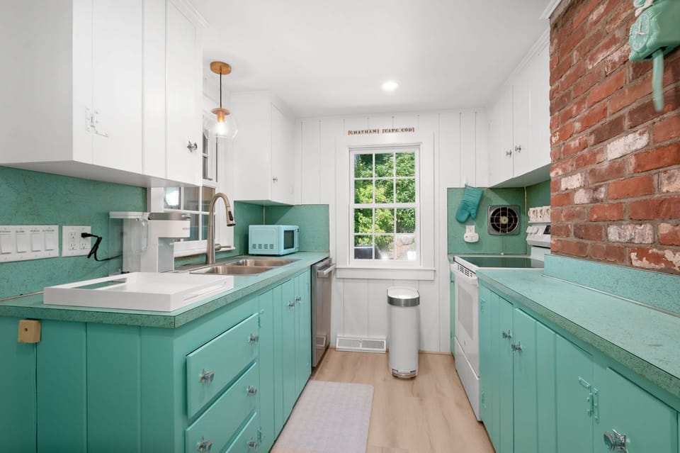 Galley kitchen with fun teal hue - 78 Bucks Creek Road Chatham Cape Cod - Saltaire - NEVR