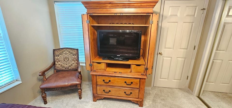 Premium chair, large bay windows, elegant armoire with TV & full cable package!
