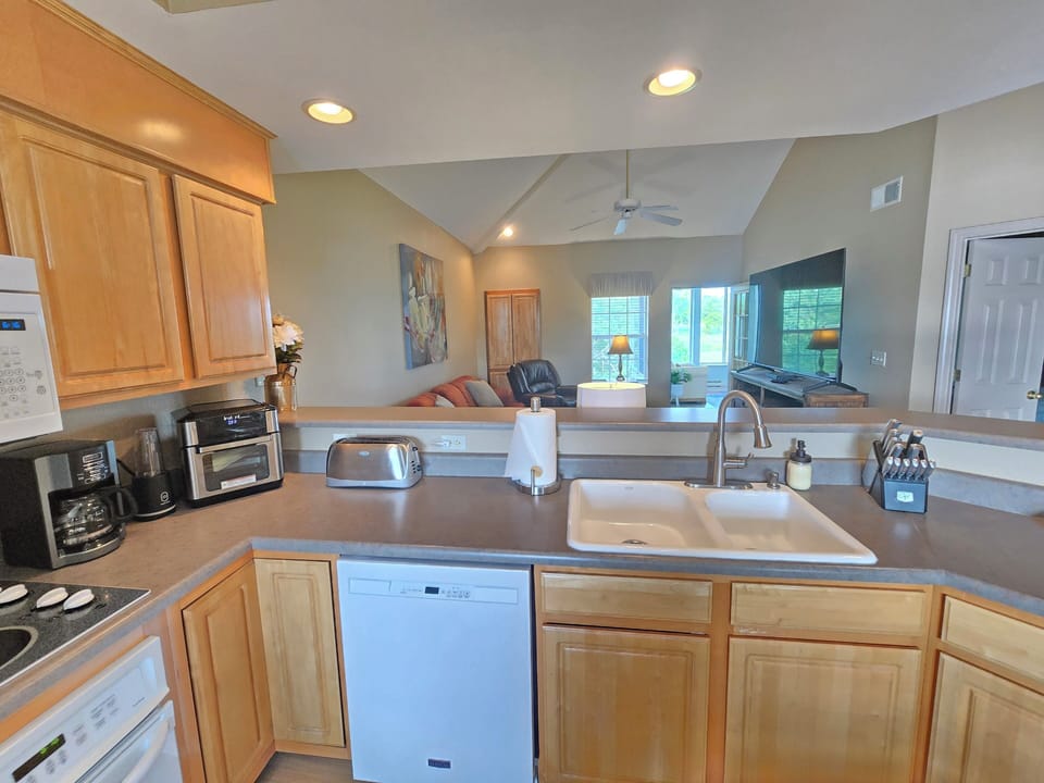 Unique view of the living room and golf course from the kitchen!