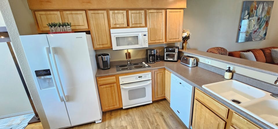 Spacious kitchen, fully stocked with all the comforts of home, & new appliances!