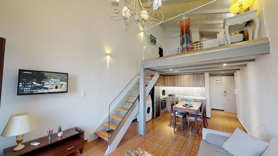 Deluxe Suite, 1 Bedroom, Sea View, Oceanfront | Living area | Plasma TV