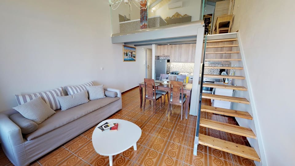 Deluxe Suite, 1 Bedroom, Sea View, Oceanfront | Living area | Plasma TV