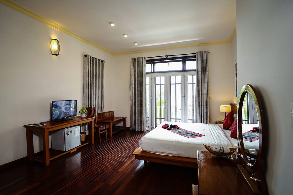 Deluxe Room, Garden View | Premium bedding, minibar, in-room safe, soundproofing