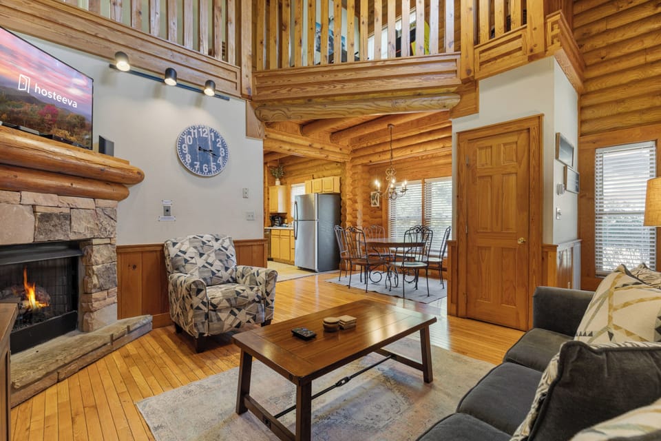 Premium Cabin, 2 Bedrooms, Hot Tub, Golf View | Living room | 50-inch Smart TV with digital channels, fireplace, foosball
