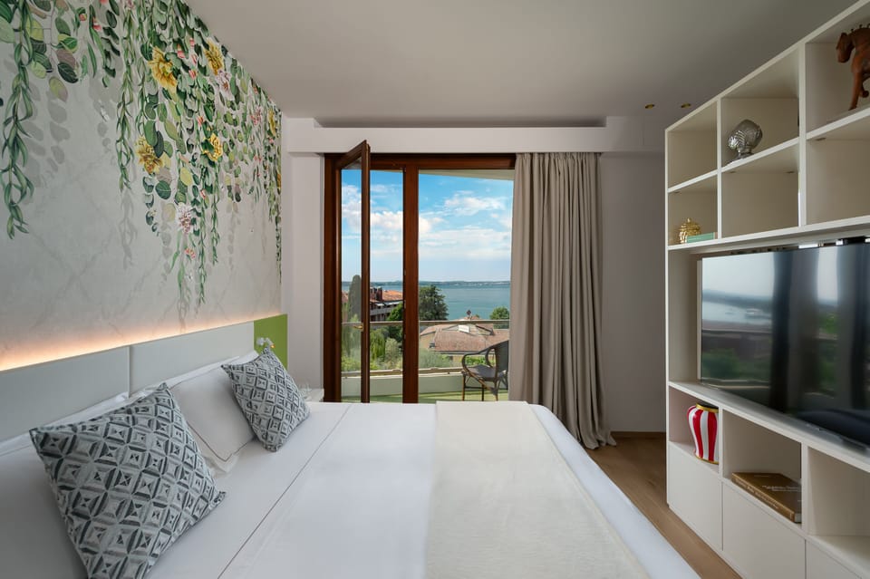 Junior Suite, Balcony, Lake View | Down comforters, minibar, in-room safe, individually furnished