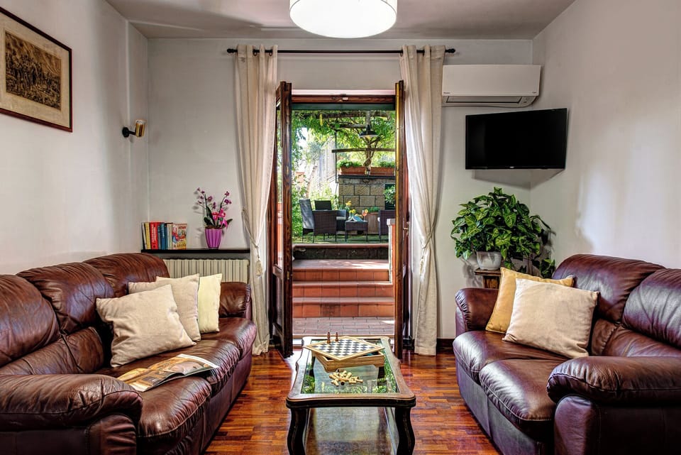 Villa, Sea View | Living area | 32-inch TV with cable channels, foosball, books