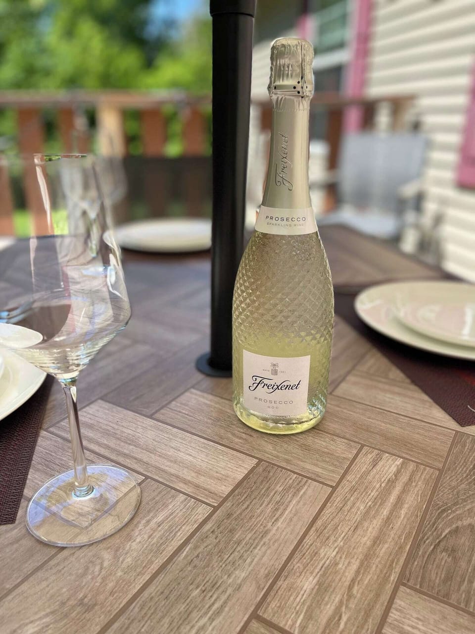Unwind with a bottle of bubbly on the patio. Perfect for dining al fresco and enjoying peaceful outdoor moments.