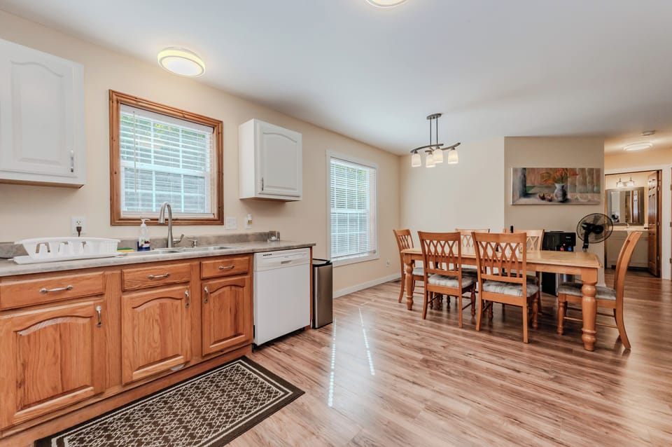 Enjoy home-cooked meals in this fully equipped kitchen with all the essentials, including a spacious dining area for gathering with family and friends.