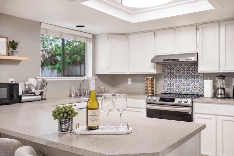 Refresh with a glass of wine in this inviting kitchen space.