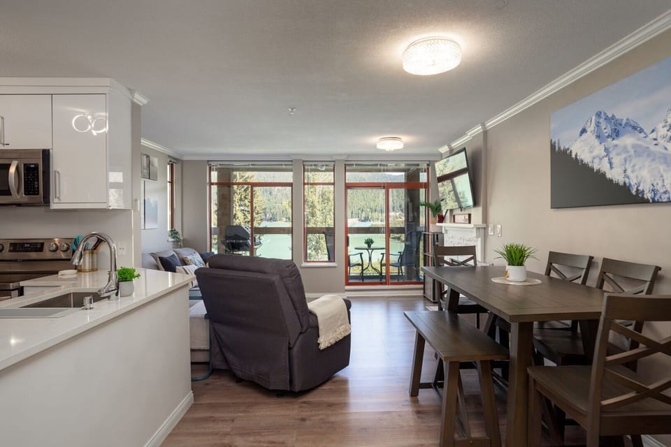 Charming dining space with seating for six and open access to the kitchen.