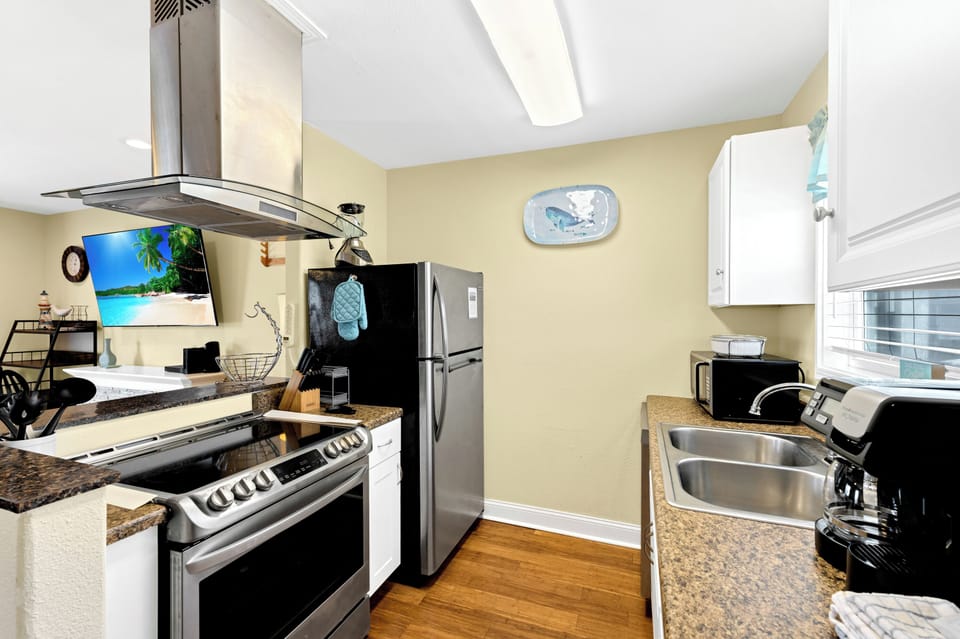 Your fully equipped kitchen awaits with granite counters, stainless appliances, and everything needed to create memorable meals during your stay.