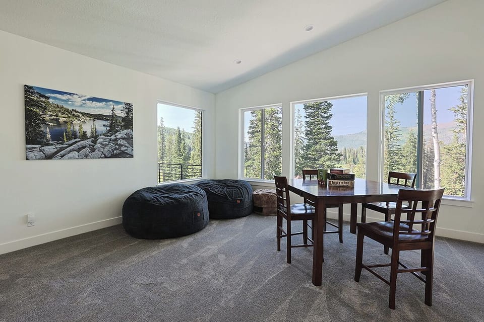 Entertainment Area on Upper Level - Closet contains board games and there is a pool table, seating, and a Smart TV around the corner