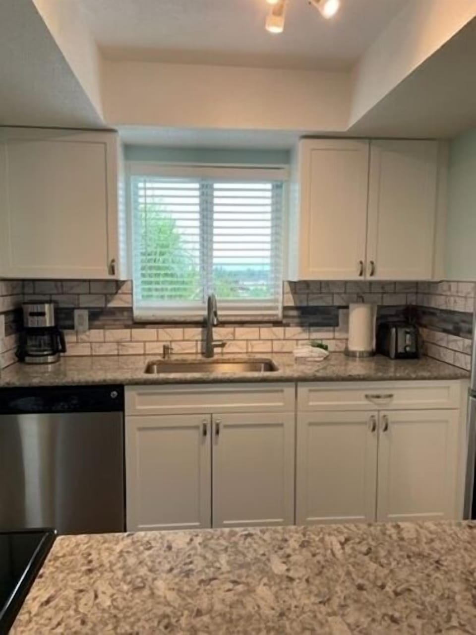 Kitchen Area - Stainless steel appliances and granite countertops