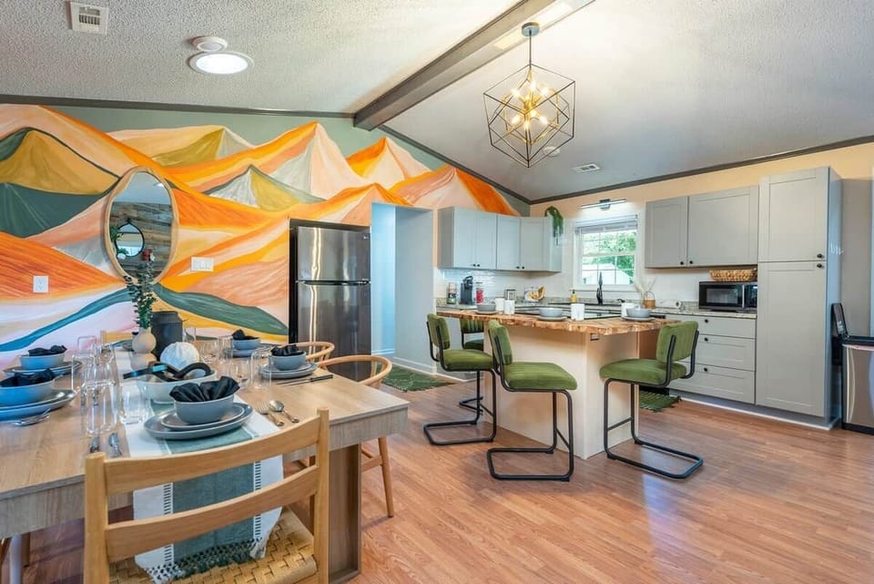 Four comfy seats wrap around the island and 6 more seats are available at the dining table