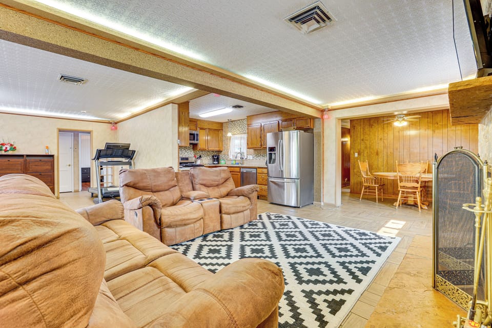 Living Room | Open Floor Plan | Flat-Screen TV | Fireplace | Treadmill