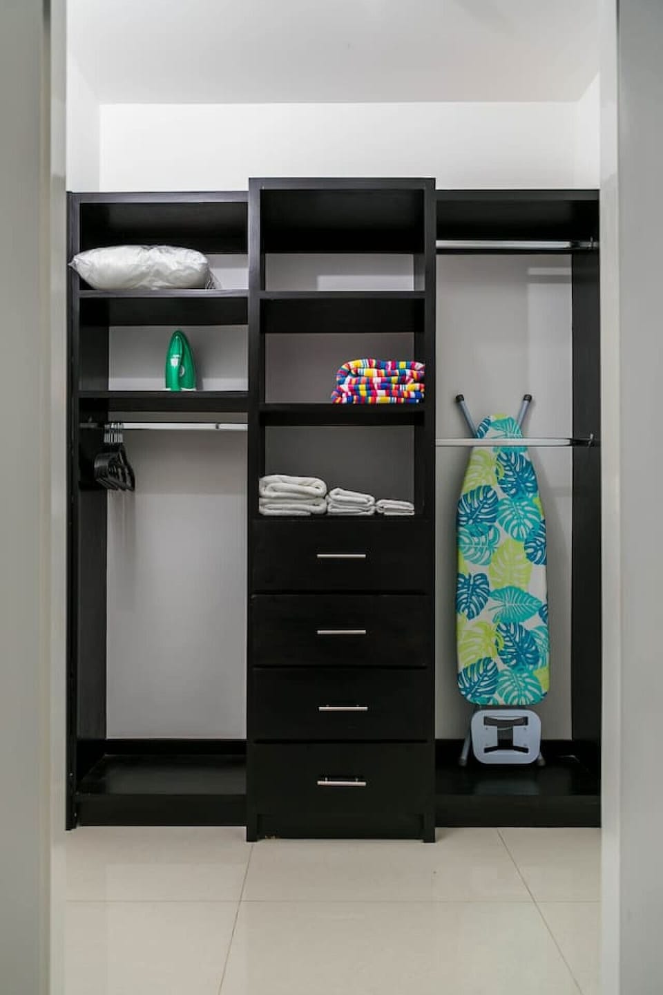 Organized closet w/ shelves, drawers & hanging space for easy unpacking