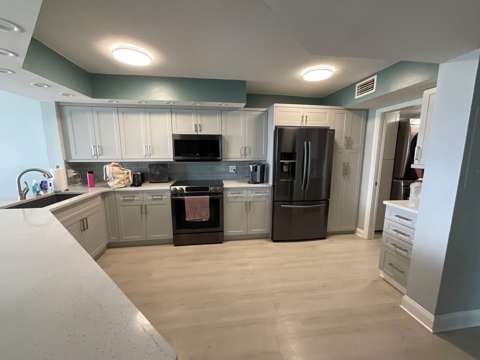 Kitchen. Small laundry room to right with washer and dryer (not pictured)
