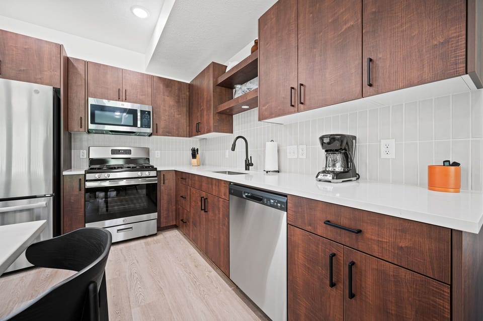 Featuring state-of-the-art appliances and a gas stove.