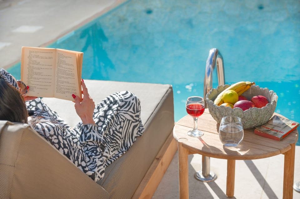 Relax with a glass of wine around the pool
