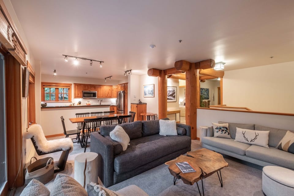 Living area: Queen sofa bed, wood burning fireplace, balcony access, TV