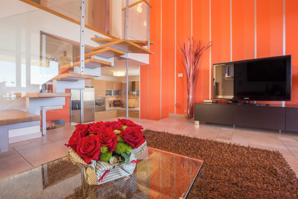 Villa, Lake View | Living area | Flat-screen TV