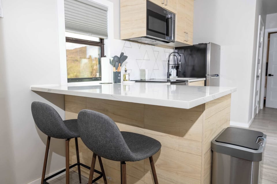 Kitchen sitting are looking towards bedroom #2. Please not we have only two interior stools due to the tight space. Additional seating is available outside and our clubhouse next door.