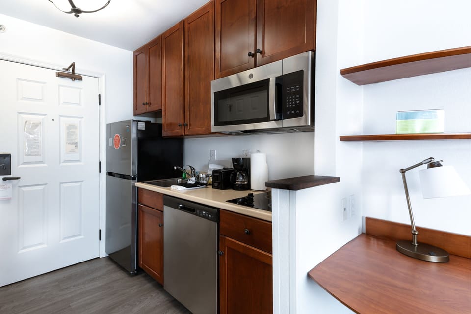 Suite, 1 Bedroom | Private kitchen | Fridge, microwave, stovetop, dishwasher