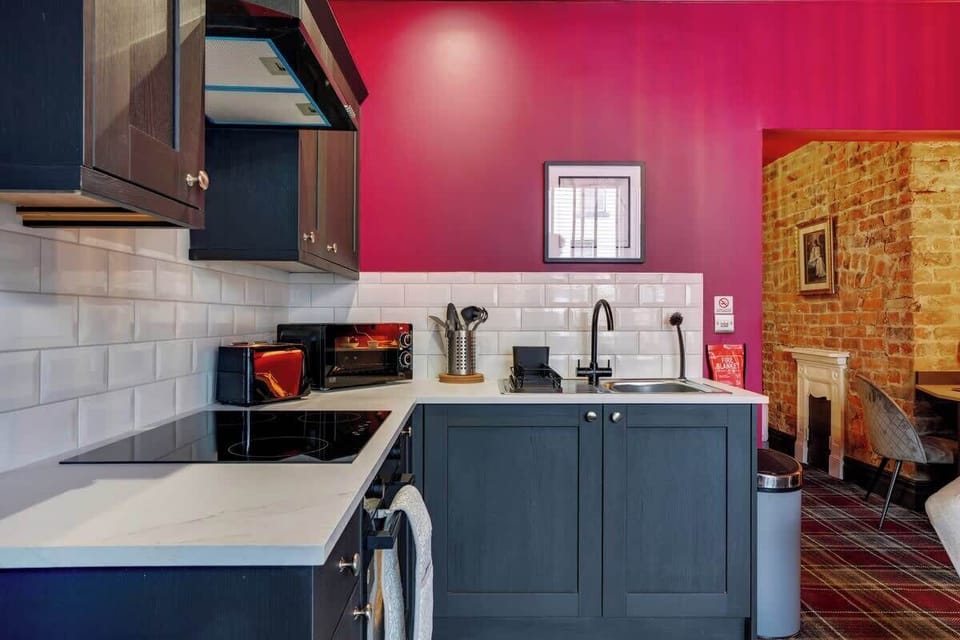 Kitchen equipped with all essentials, including a washer & dryer, oven, fridge and full cookware set.
