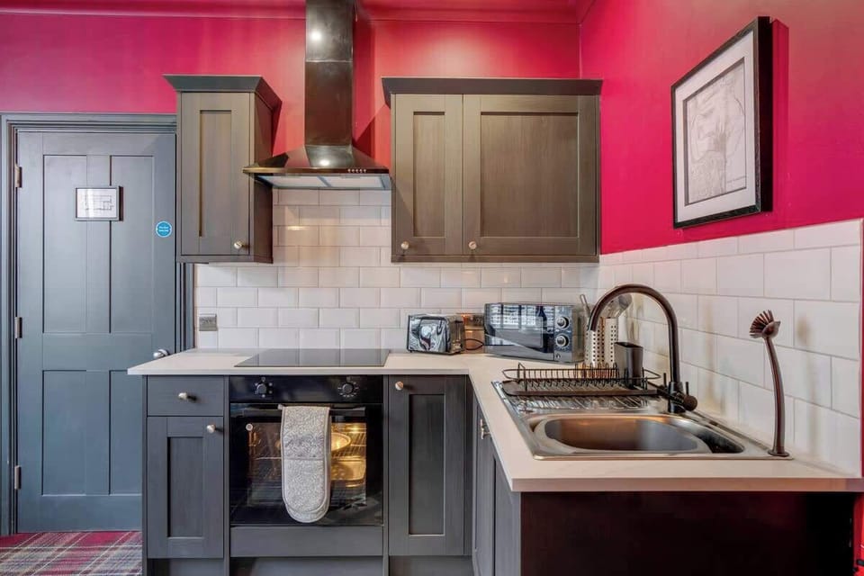 Kitchen equipped with all essentials, including a washer & dryer, oven, fridge and full cookware set.