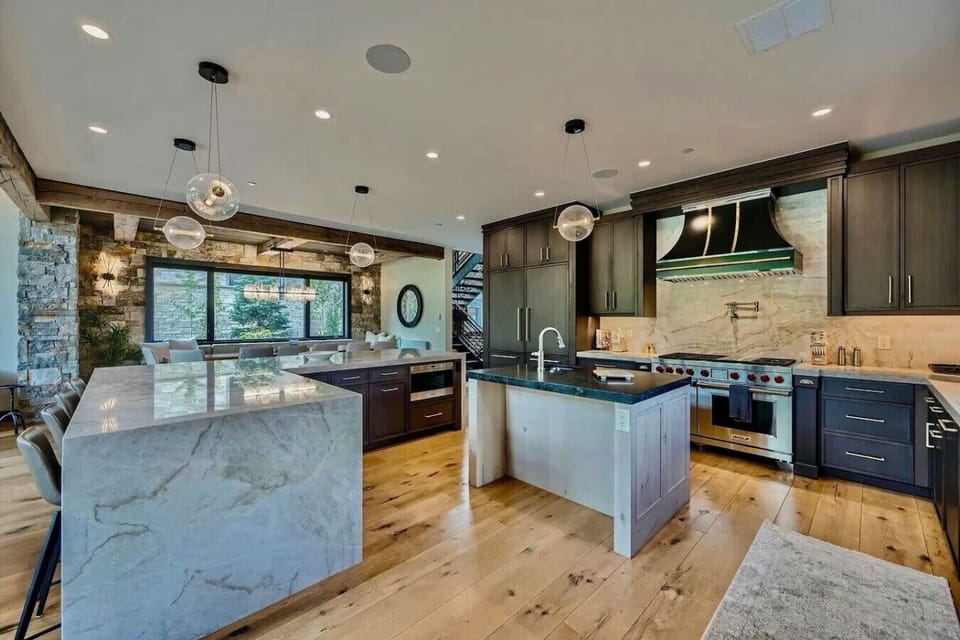 Cook in style in this gourmet kitchen featuring high-end appliances, sleek countertops, and plenty of space for preparing meals while enjoying beautiful mountain views
