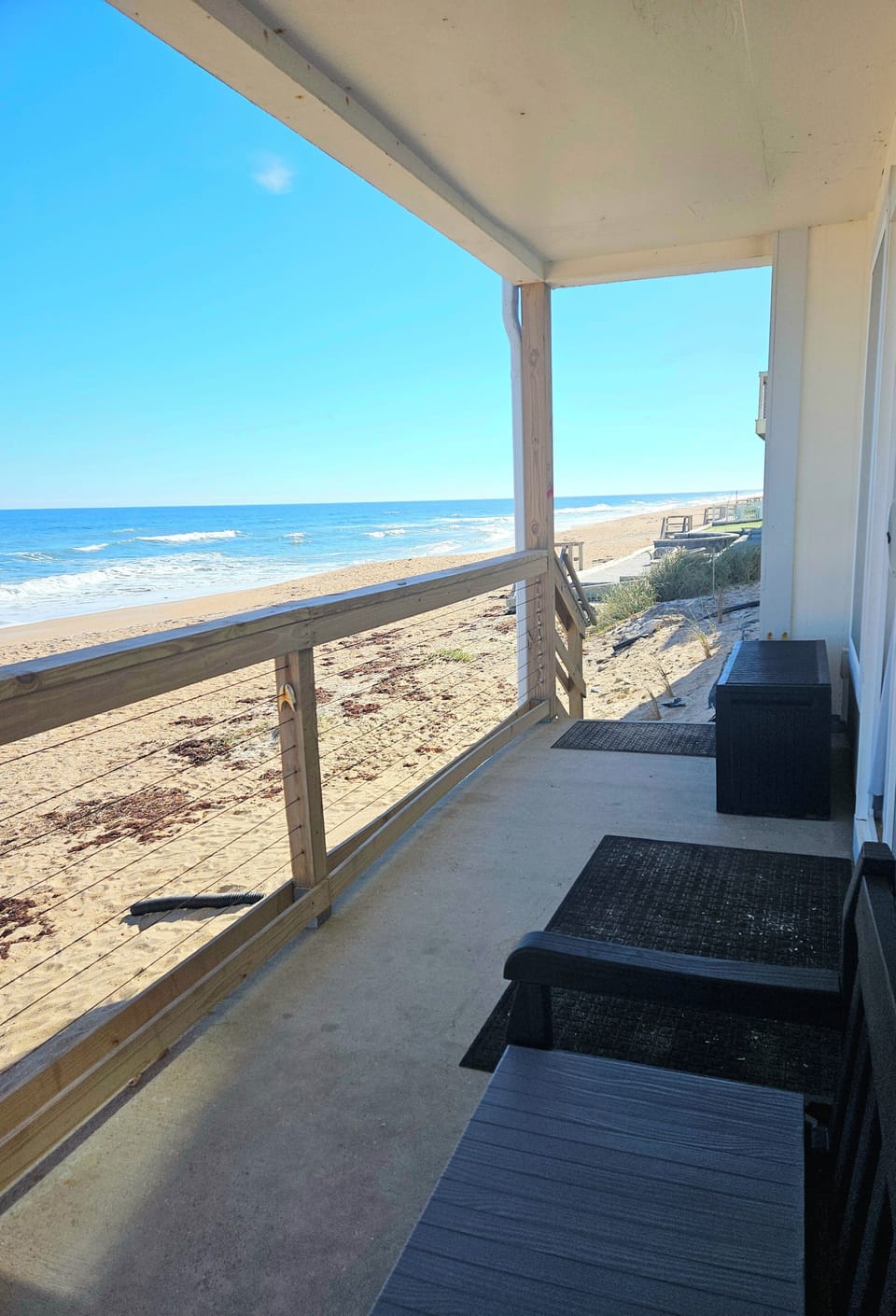 Your own slice of paradise. Enjoy sweeping ocean views, refreshing sea breezes, and direct access to a wide sandy beach from this private ground-level patio—the perfect spot for morning coffee or sunset relaxation.