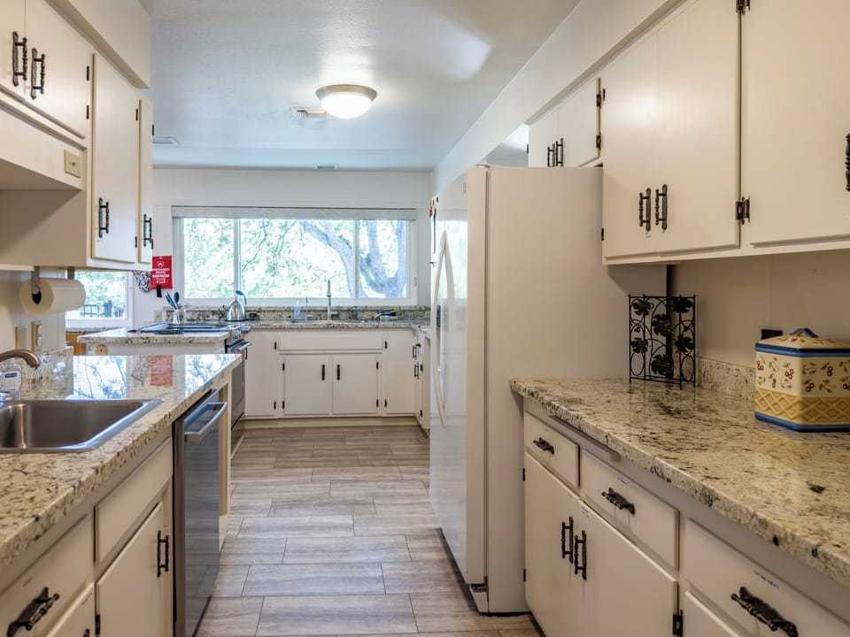 Kitchen view from hallway. View of part of the kitchen with seating area on left