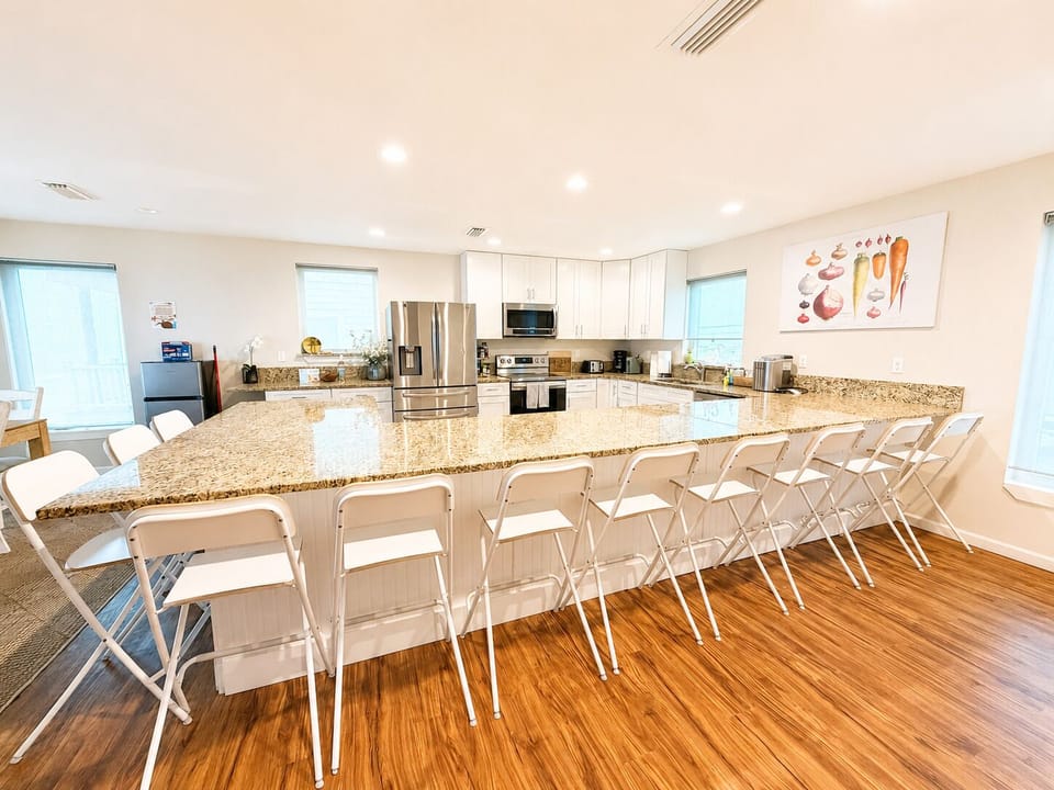 Gather around the spacious oceanfront kitchen and oversized island