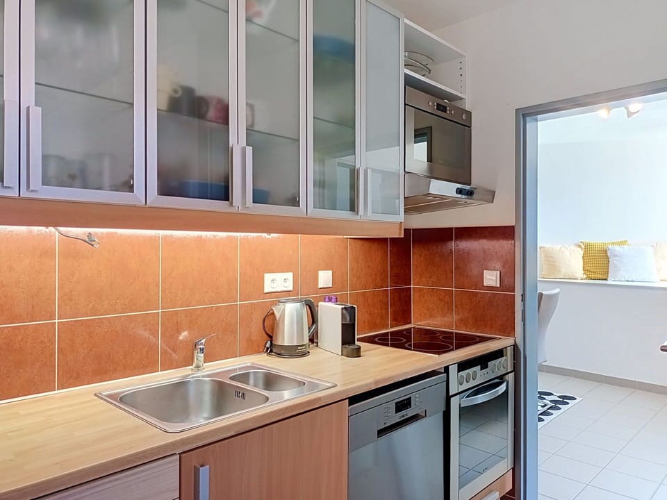 Kitchen, Countertop, Major Appliance, Kitchen Appliance, Interior Design, Cabinetry, Flooring, Wood, Kitchen Sink, Ceiling