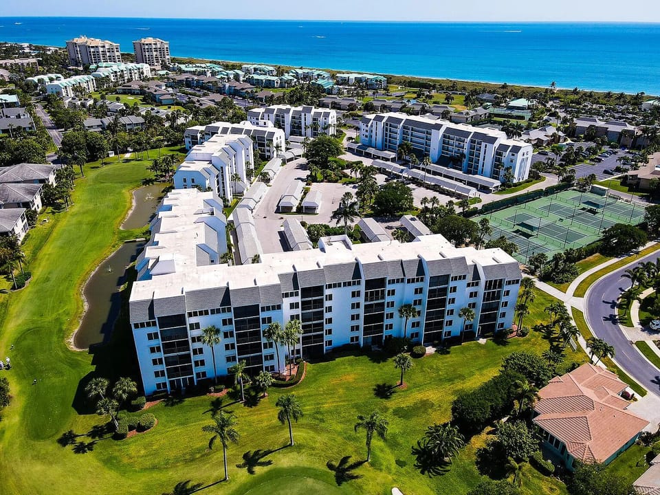 Overview of property with view of proximity to the beach, some amenities visible