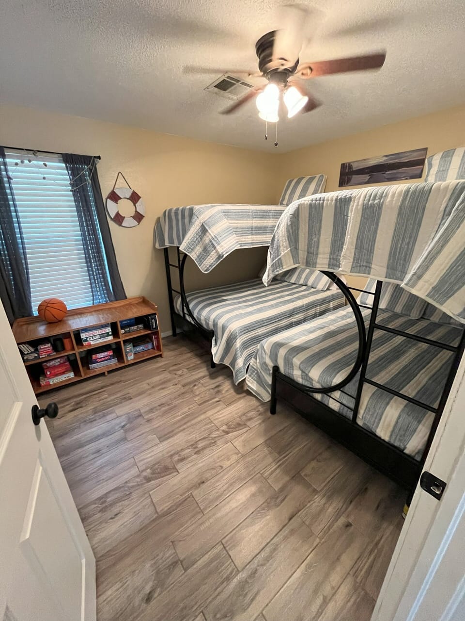 Bunk room with 2 twin over full beds as well as games and Xbox console.