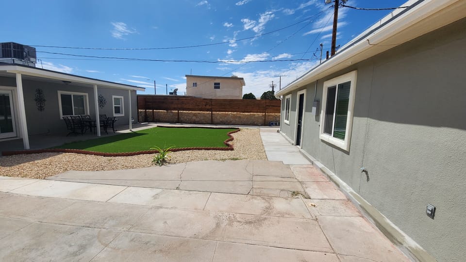 Backyard area located between main home and studio.