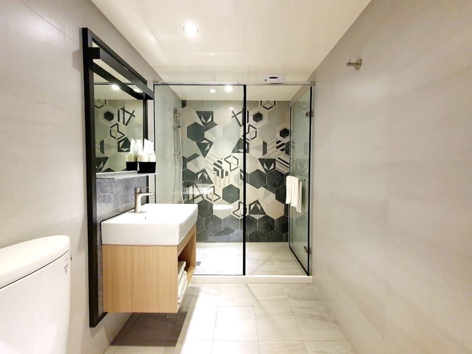 Shower, rainfall showerhead, hair dryer, towels