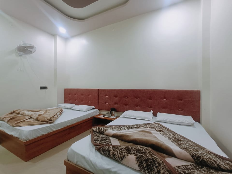 Comfort Quadruple Room, City View | WiFi (free), bed sheets