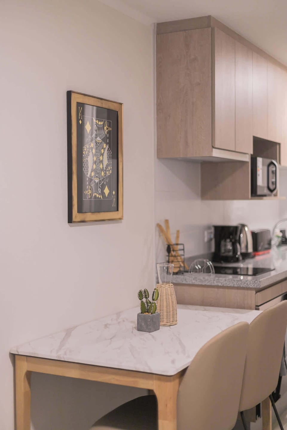 Cozy kitchen nook with modern appliances and stylish decor, perfect for a quick meal or morning coffee.