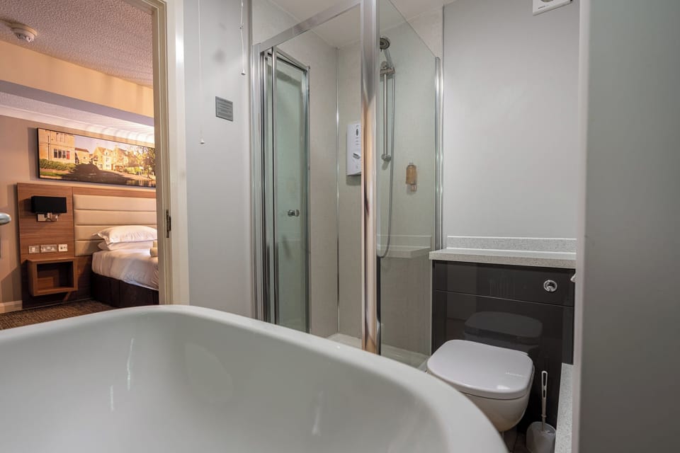 Family Room | Premium bedding, desk, laptop workspace, free WiFi