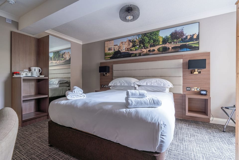 Family Room | Premium bedding, desk, laptop workspace, free WiFi
