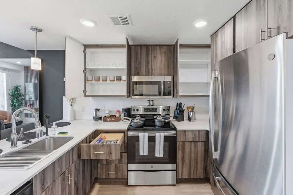 Keep your meals fresh and delicious with our spacious refrigerator, complete with a full set of kitchen essentials.